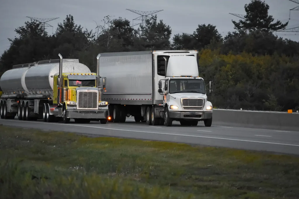 Heavy vehicles on an Australian highway, the operators covered by the Heavy Vehicle National Law reforms