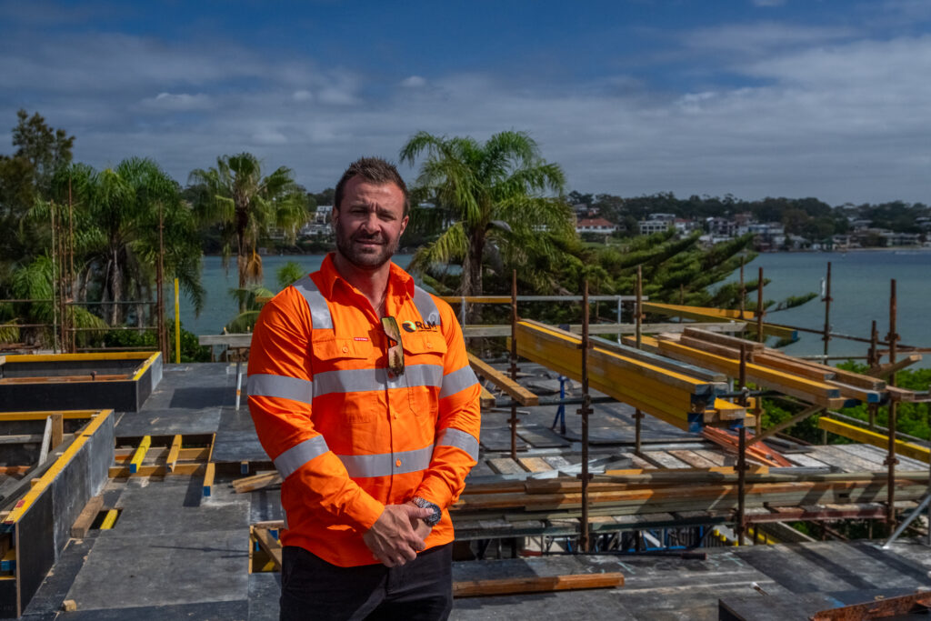 RLM consultant on a Sydney construction site overlooking the harbour